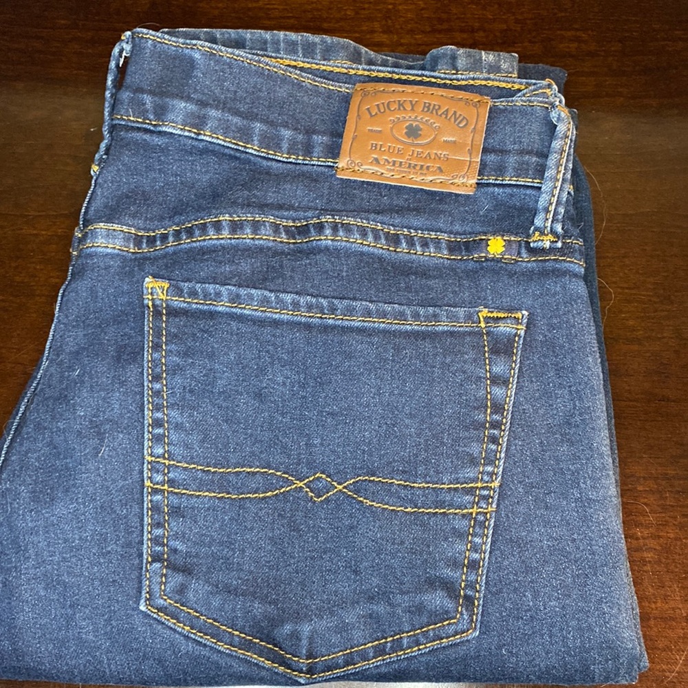 Lucky Brand used dark blue jeans